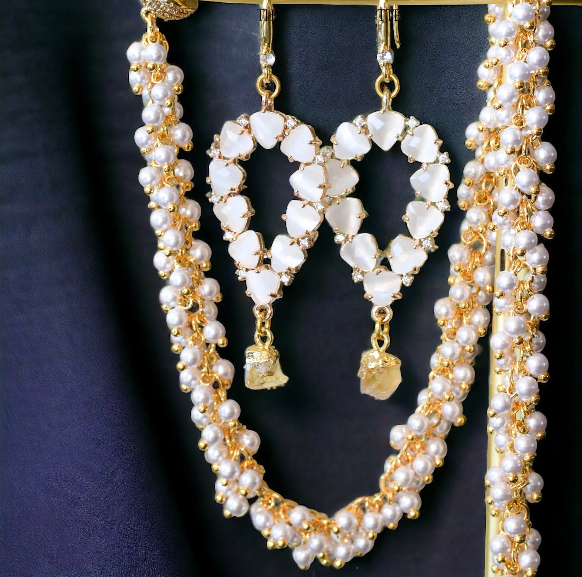Yara white stones with gold edged peridot drop earrings