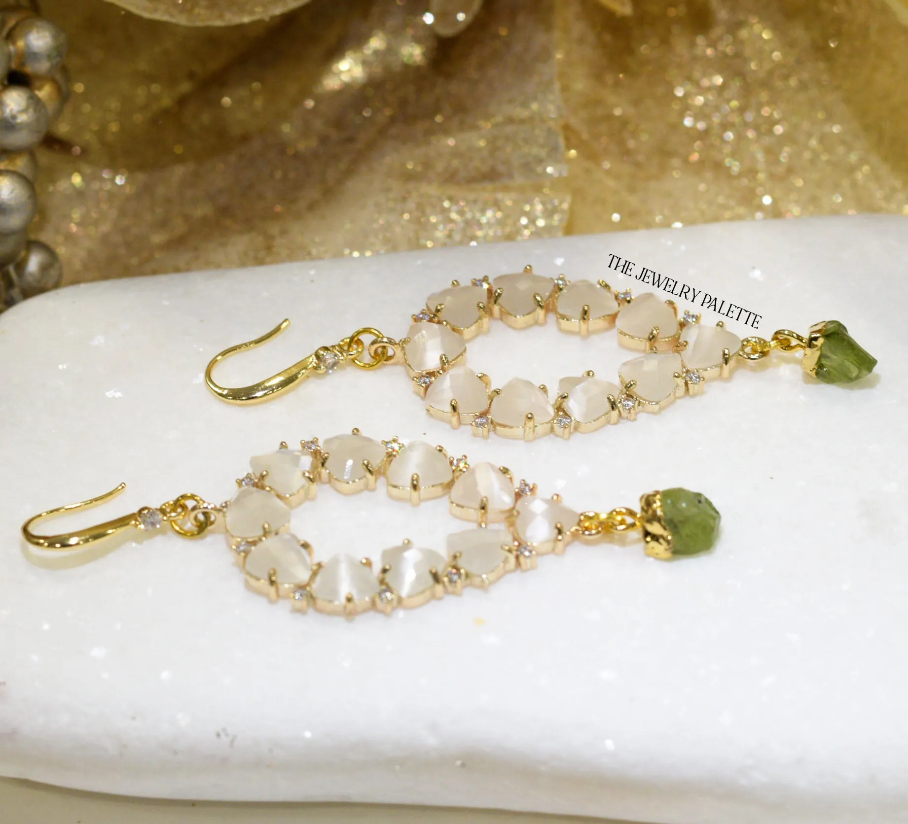 Yara white stones with gold edged peridot drop earrings